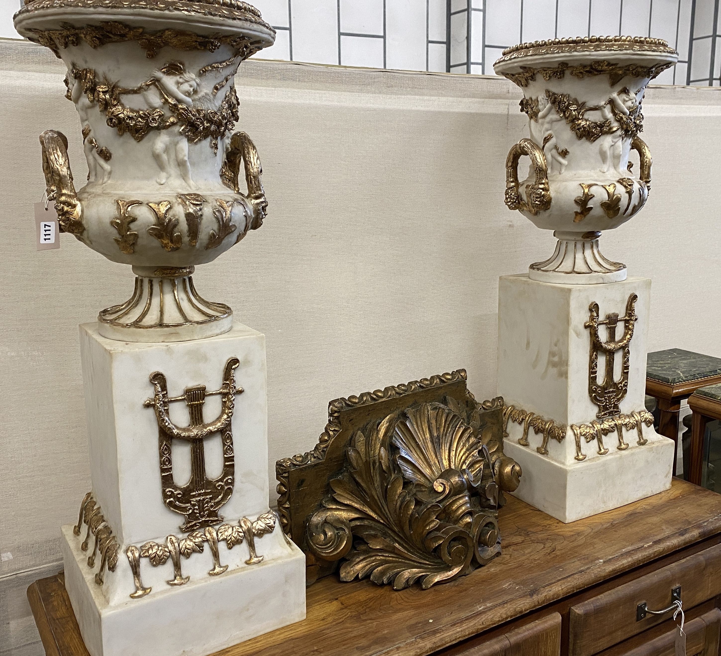 A pair of composition faux marble campana garden urns on stands, width 30cm, height 93cm